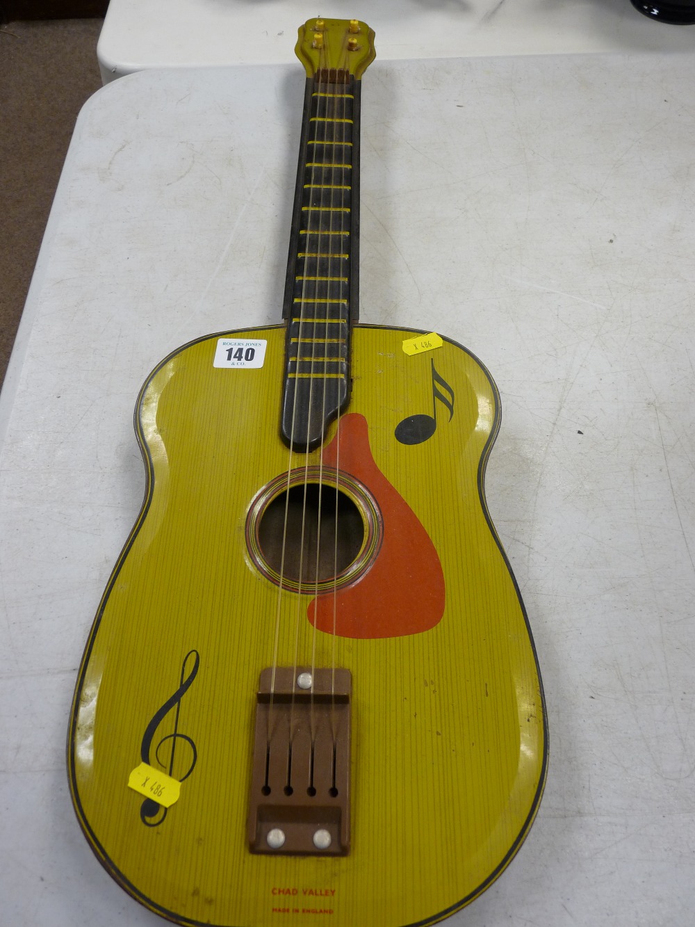 Children's tinplate guitar by Chad Valley