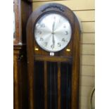 Oak cased dome topped longcase clock with triple weights and pendulum