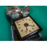 Two vintage mantel clocks together with a square faced wall clock