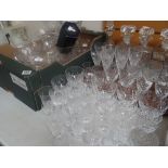 A good selection of cut glass items including four decanters, good quality drinking glasses, vases