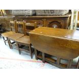 A good vintage reproduction drop leaf oak gate table with end drawer together with three oak