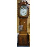 An antique inlaid mixed wood Victorian grandfather clock having a painted rolling moon dial, eight-