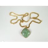 A modern 9ct yellow gold curb chain necklace 13gms attached with mineral pendant Please note: