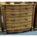 A nineteenth century mahogany chest of two short above three long drawers having flanking column