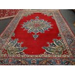 A good large rust ground floral Persian carpet, 340 x 245cms