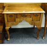 An antique nineteenth century walnut low boy having three drawers with inlay and on cabriole