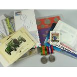 A parcel of first day covers, coin sets and two military medals