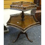 A good antique galleried tripod mahogany dumbwaiter having two shaped graduated tiers on carved