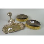 Pair of silver backed clothes brushes, pierced silver dish with centred monogram and a loaded silver