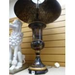 An ebonized and gilt decorated Chinese table lamp and shade by Theodore Alexander