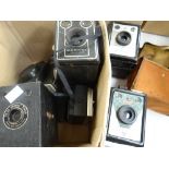 Collection of vintage cameras including a Coronet console, a Coronet ambassador, a Kodak Brownie