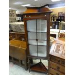 A neat mahogany and inlaid standing corner cabinet with railback, glazed upper door and bottom