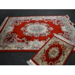 Red ground Chinese-style wash rug and similar runner, 255 x 168cms & 95 x 60cms (2)