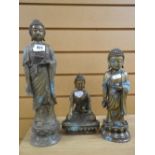 Three similar metallic buddha figures in various poses, the tallest being 37cms high