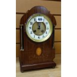 A good Edwardian inlay and box-string mahogany architectural mantel clock having brass pillars and