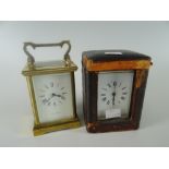 A vintage brass encased French carriage clock with outer fitted case and another later carriage