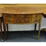 An antique inlaid mahogany compact bow front sideboard with bottom long drawer and three upper