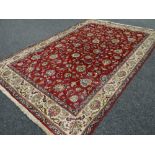 A good large rust ground floral Persian carpet, 340 x 235cms