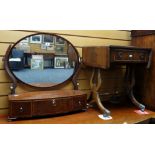 An antique mahogany bow front toilet mirror having three drawers together with a small