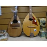 A Czechoslovakian mandolin and a Neapolitan mandolin (distressed)