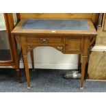 A vintage kneehole desk with marquetry detail and tooled leather top, 83cms wide