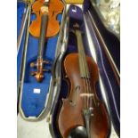 Two cased vintage violins