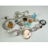 AN ASSORTMENT OF SILVER JEWELLERY to include cameo brooch, rings etc.