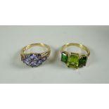 TWO NINE CARAT GOLD RINGS, one with peridot, the other with tanzanite