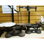 THREE VINTAGE CAST METAL WEIGHING SCALES