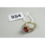 DIAMOND RING being an 18-carat yellow gold ruby and diamond chip ring in box, 3.7 grams