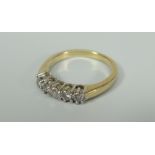 18CT YELLOW GOLD FIVE STONE DIAMOND RING. Total diamond weight 0.30ct (visual estimate), 4.2 grams