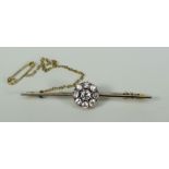 DIAMOND SEVEN STONE FLOWER HEAD OR CLUSTER BAR BROOCH set in yellow metal. Overall diamond carat