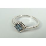 14K WHITE GOLD PRINCESS BLUE DIAMOND BAND BY SOPHIA FIORI. Estimated total stone weight 0.26ct, 1.