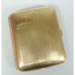 9CT YELLOW GOLD ENGINE TURNED CURVED CIGARETTE CASE WITH MONOGRAM. 73 grams approximately. Condition