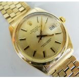 ROLEX OYSTER PERPETUAL DATE 14K GOLD GENTLEMAN'S WRISTWATCH on 14ct gold Rolex brick link bracelet