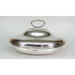 EDWARD VII SILVER ENTREE DISH AND COVER OF OVAL FORM WITH PIERCED LIFT OUT INSERT. The dish having