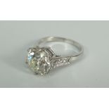 A CUSHION-CUT DIAMOND SOLITAIRE RING visual estimate 4.2ct and estimated as L colour and SI clarity,