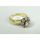 18CT YELLOW GOLD DIAMOND FLOWER CLUSTER RING, the central stone (approximately 0.40ct), surrounded