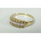 9CT YELLOW GOLD THREE ROW YELLOW AND WHITE DIAMOND RING. 1.9 grams approximately. Condition