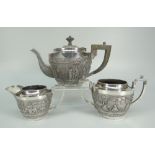 AN INDIAN STERLING SILVER THREE-PIECE TEASET comprising teapot, sucrier and cream jug, overall