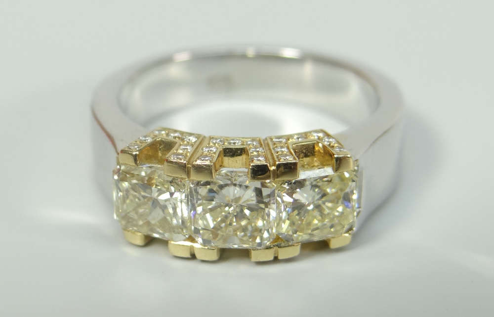 18CT WHITE GOLD THREE STONE YELLOW DIAMOND RING, having further diamond chips to setting. Total - Image 2 of 3