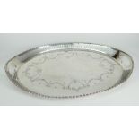 GEORGE V SILVER TWIN HANDLED TRAY OF OVAL FORM HAVING PIERCED BORDER with engraved swag and floral