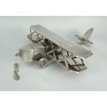 EARLY 20TH CENTURY WHITE METAL TWO SECTION MODEL OF A BI PLANE with engraved inscription to wings "