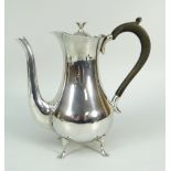 EDWARD VII SILVER POT BELLIED COFFEE POT RAISED ON FOUR SPLAY FEET with wooden handle and flower