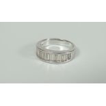 18K WHITE GOLD BAGUETTE CUT DIAMOND HALF ETERNITY RING, set with a horizontal graduated row of