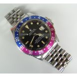 ROLEX GMT-MASTER 'FUCHSIA' WRISTWATCH with later jubilee bracelet, model 1675, serial number
