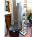 A silver finished Zanussi upright fridge freezer, a black IceQ bar top fridge and a Dyson DC03