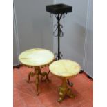 Two onyx and brass circular topped side tables, 35 and 43 cms diameter and a wrought iron planter