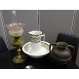 Vintage brass oil lamp with cranberry frill shade (chipped), a Victorian wash jug and bowl and a