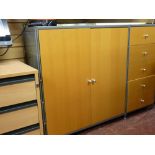 An ultra modern metal and light wood storage system, similar good home office furniture and a